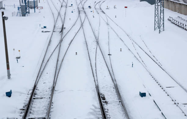 istock Winter railway road with white snow. Rails in the snow 1296214365