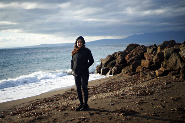 istock woman alone at the beach 1296214400