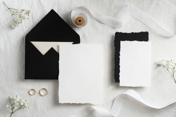 istock Wedding stationery mockup. Blank greeting card, invitation template. Flat lay envelope, blank paper card, ribbon, flowers on pastel white background. 1296216623