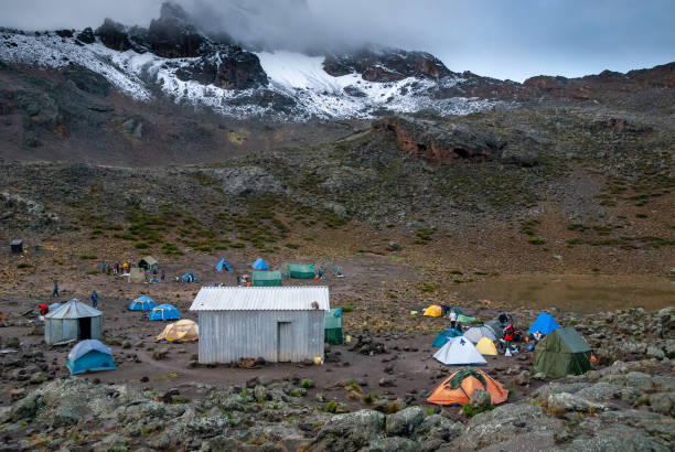 Mawenzi Tarn Hut camp on Rongai route to Kilimanjaro Mount Kilimanjaro National Park mawenzi stock pictures, royalty-free photos & images