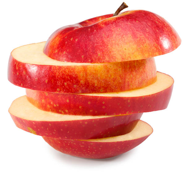 istock red apples with slices isolated on white background. clipping path. 1296217582