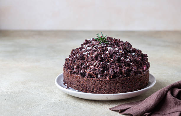 Homemade chocolate cake with cherry and whipped cream. Cake Mink mole or Mole hole cake.