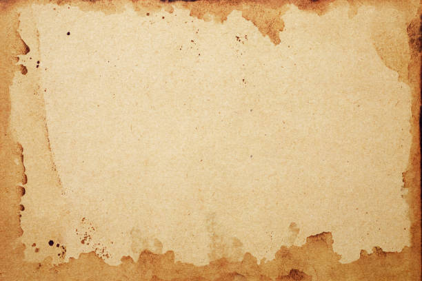 istock Old brown paper grunge background. Abstract frame liquid coffee color texture. 1296218046