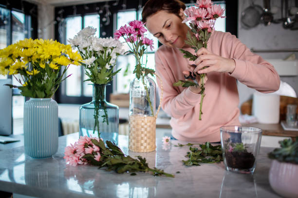 istock Arranging a flowers at home. 1296218054