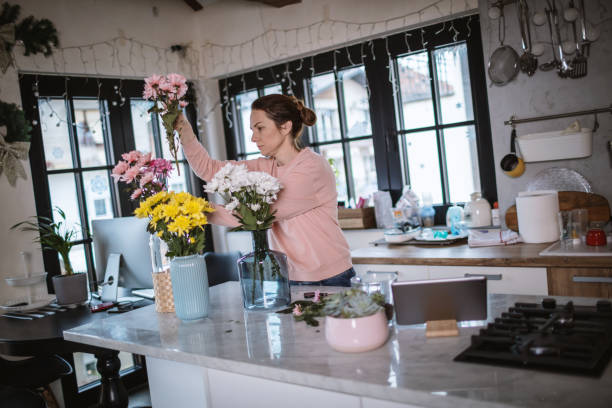 istock Arranging a flowers at home. 1296218931