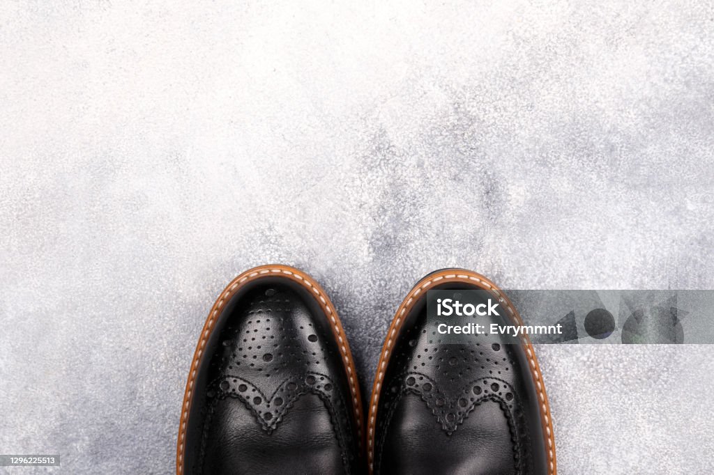 Studio shots of stylish men’s footwear. A pair of black patent leather oxford shoes isolated on white background. Versatile business casual dress wingtip. Top view, copy space for text, flat lay. Brogue Stock Photo