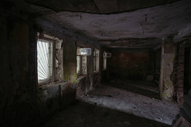 istock Dark creepy rotten abandoned building 1296227970