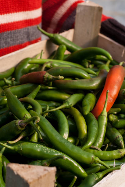 istock Wooden box with hot peppers 1296229453