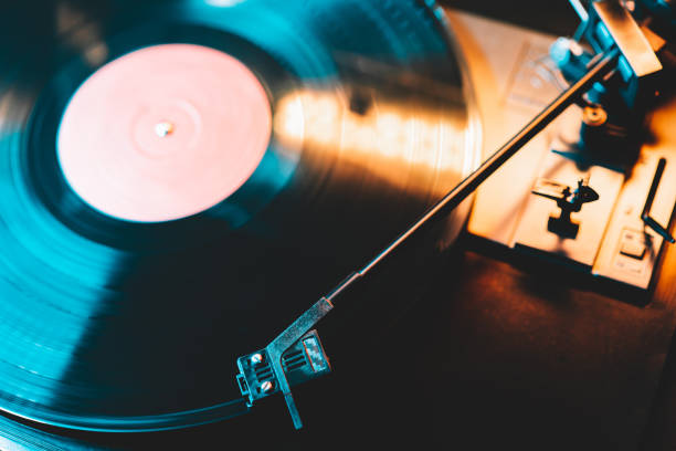 istock Retro-styled spinning record vinyl player. Close up. Rotating vintage phonograph close up. Beautiful colorful image. 1296229980