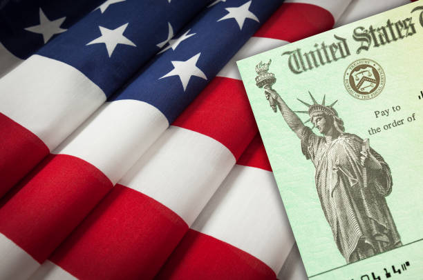 istock United States IRS Stimulus Check Resting on American Flag 1296230164