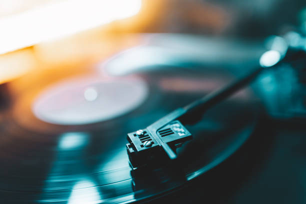 istock Retro-styled spinning record vinyl player. Close up. Rotating vintage phonograph close up. Beautiful colorful image. 1296230246