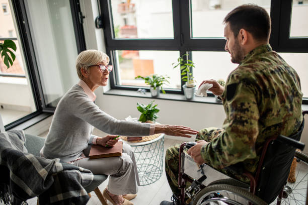istock Depressed soldier and his psychotherapist during a session 1296230864