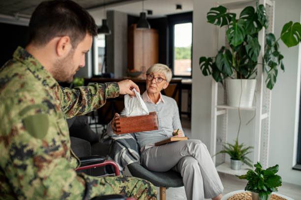istock Depressed soldier and his psychotherapist during a session 1296233879