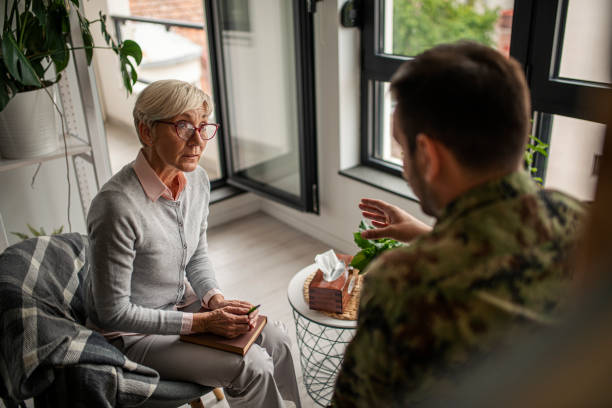 istock Depressed soldier and his psychotherapist during a session 1296233884