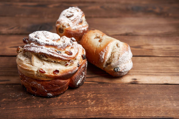 istock Traditional easter cake Kraffin stands on wooden table against a dark background. 1296234869