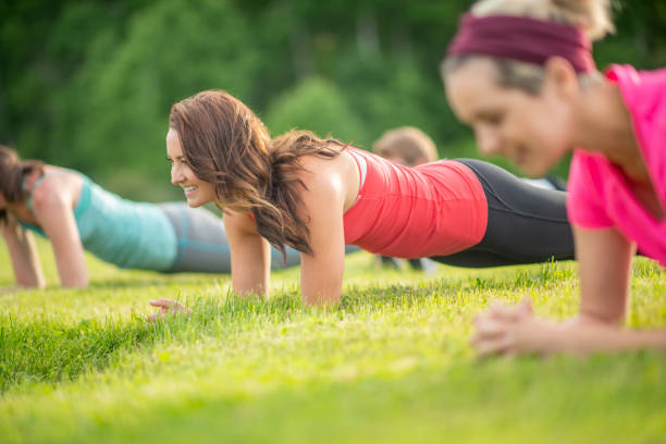 istock Female athlete doing planking position outdoors 1296235263