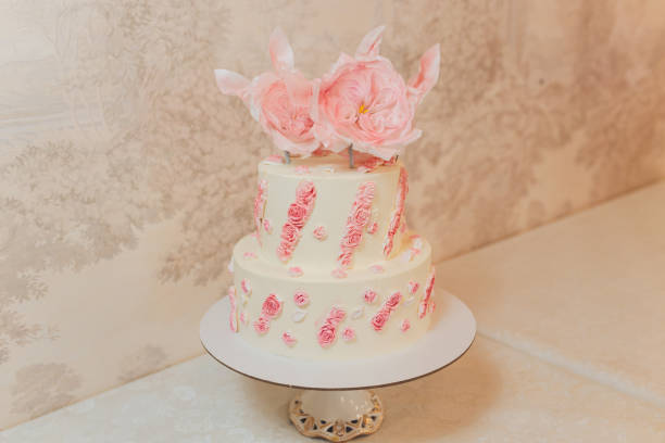 istock Wedding cake with flowers, figs, macarons and blueberries. 1296235302