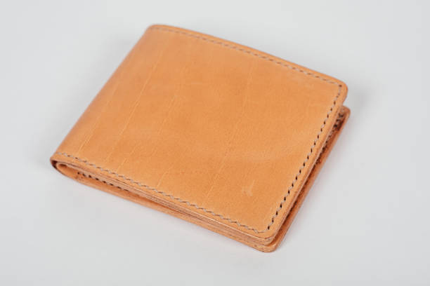 istock genuine leather wallet brown color on isolated white background. 1296235383