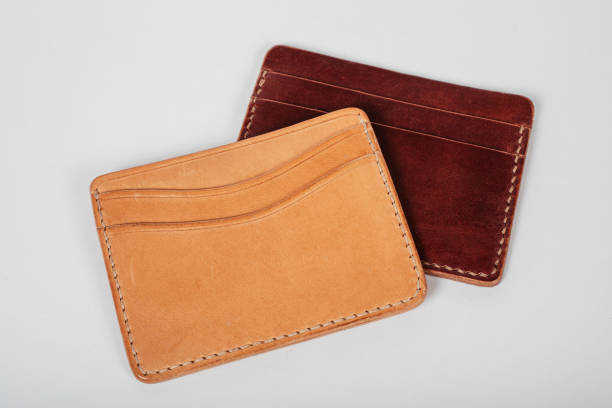 istock genuine leather wallet brown color on isolated white background. 1296235404