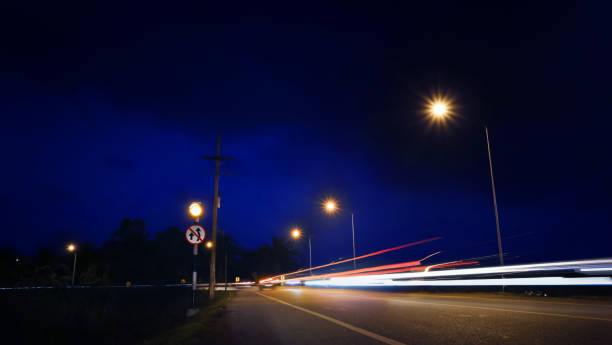 istock Long-exposure of traffic light trails at nigh. 1296240604