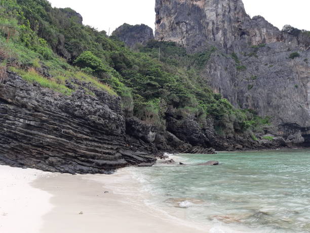 istock large rock formation on a beach in thailand 1296244662