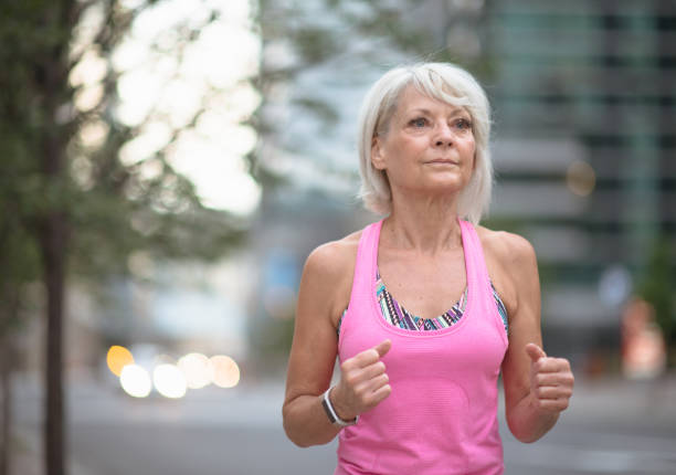 istock Staying fit with a jog outdoors 1296247212