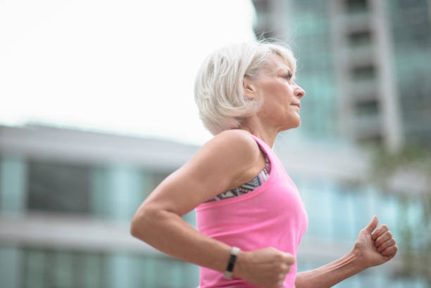 istock Senior female staying active outdoors 1296247214