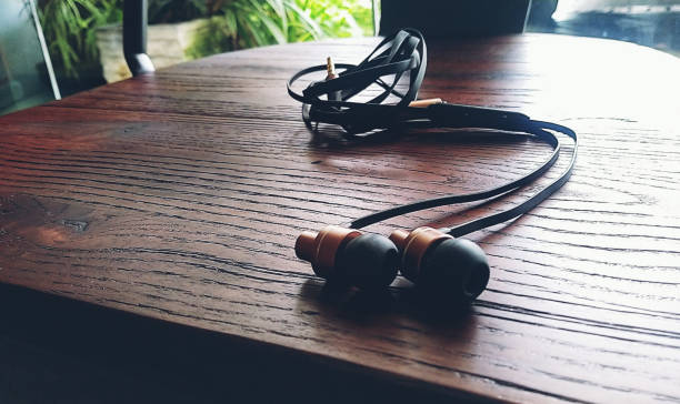 istock earphones on the brown chair 1296252465