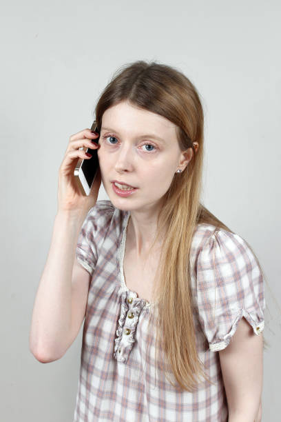 istock Young woman talking on mobile phone 1296253665