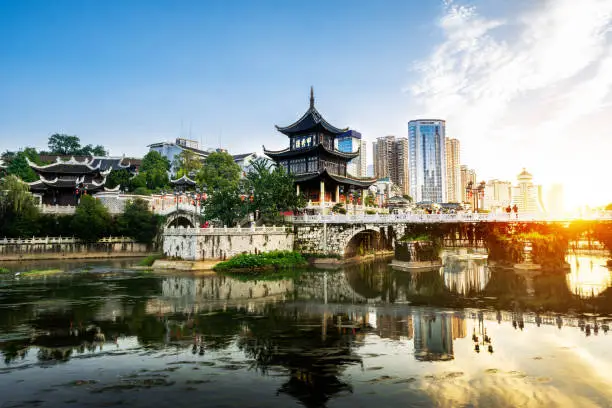 Photo of Guiyang, China skyline at Jiaxiu Pavilion on the Nanming River. Translation: