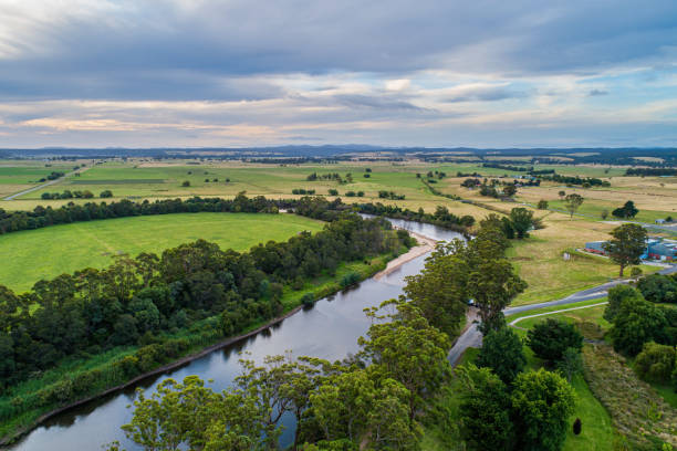 istock Scenic countryside and river bend - aerial view 1296255409