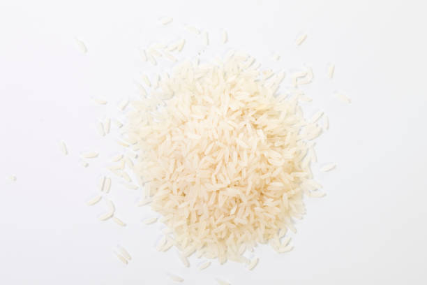 istock Rice in a pile on a white background. 1296255570