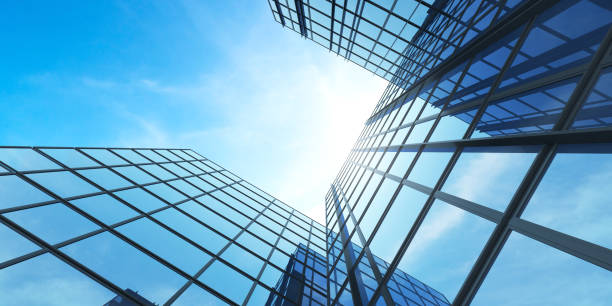 istock Low angle view of futuristic architecture, Skyscraper office building with cloud reflected on window, 3D rendering. 1296260484