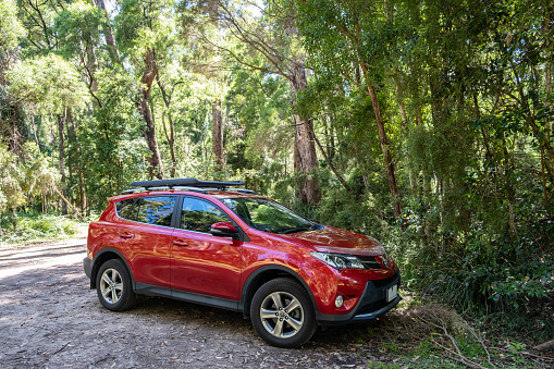 Cabbage Tree Creek, Australia Circa December 2020: SUV vehicle parked in a lush forest
