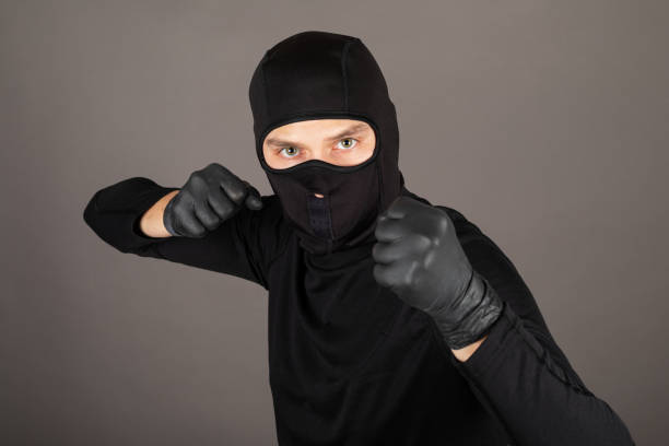 istock Criminal punching towards the camera 1296263847