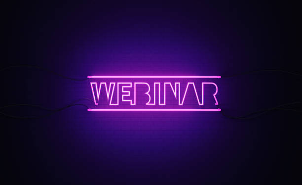 istock Purple Neon Light Writes Webinar on Black Wall 1296264822
