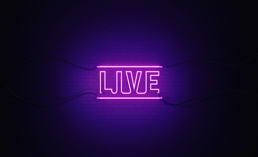 Purple neon light writes live on black wall. Horizontal composition with copy space. Live broadcast concept.