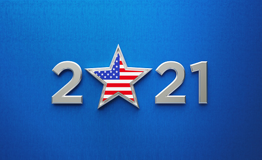 Metallic 2021 and a star textured with American flag sitting over dark blue background. Horizontal composition with copy space. Directly above.