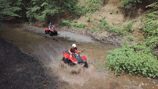 Driving off-road with quad bike or ATV vehicles. 4x4