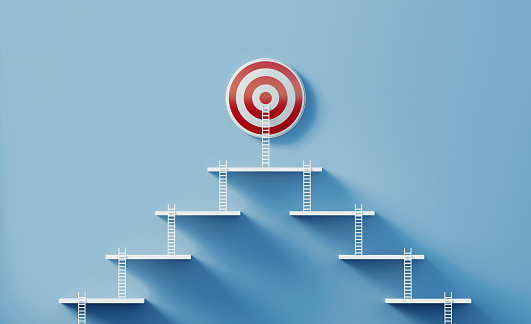 Two different paths formed by white ladders reaching the same red bull's eye targets on blue wall.  Horizontal composition with copy space. Success, partnership and strategy concept.