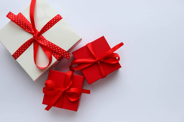 istock valentine's day background. gift box on a white background and a red heart 1296268278
