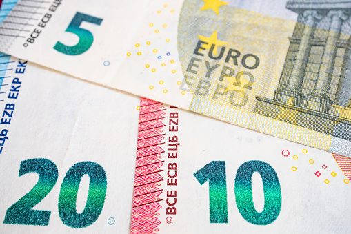 close up euro banknotes on grey background
