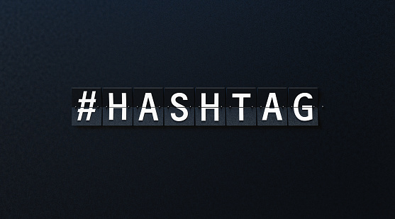Hashtag written airport billboard on black background. Horizontal composition with copy space.
