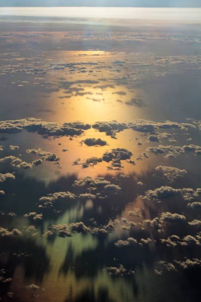 istock clouds seen from an airplane with the sea in the background 1296271442