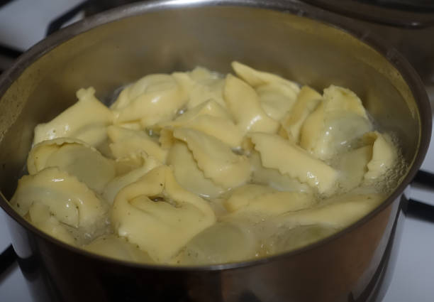 istock Ravioli stuffed with spinach cheese and pine nuts being cooked in a pan 1296271892