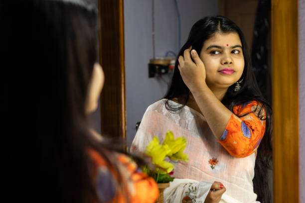 istock Indian woman in front of mirror 1296272071