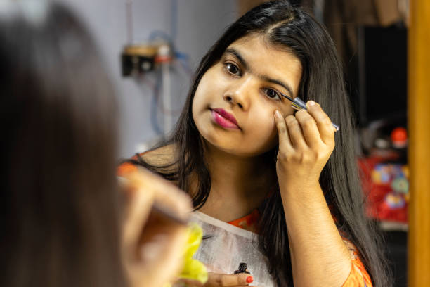 istock Indian woman in front of mirror 1296272579