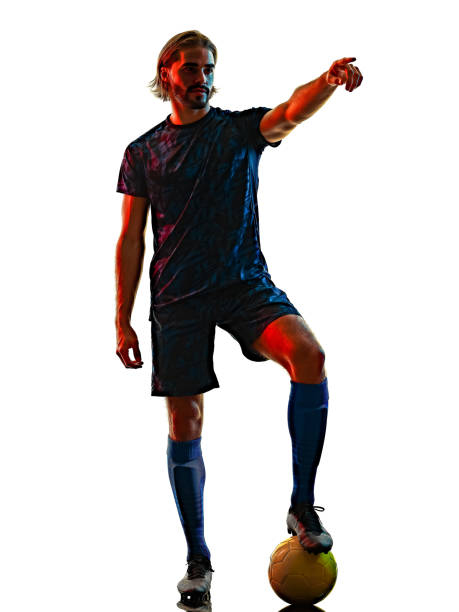 istock young soccer player isolated white background silhouette shadow 1296274125