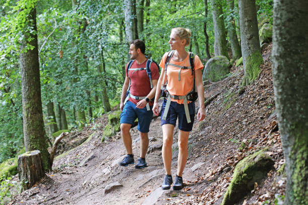 istock Young couple hiking in the Palatinate forest (Pälzerwald), Germany 1296275675