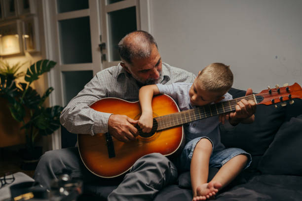 istock grandfather and grandson at home 1296275958